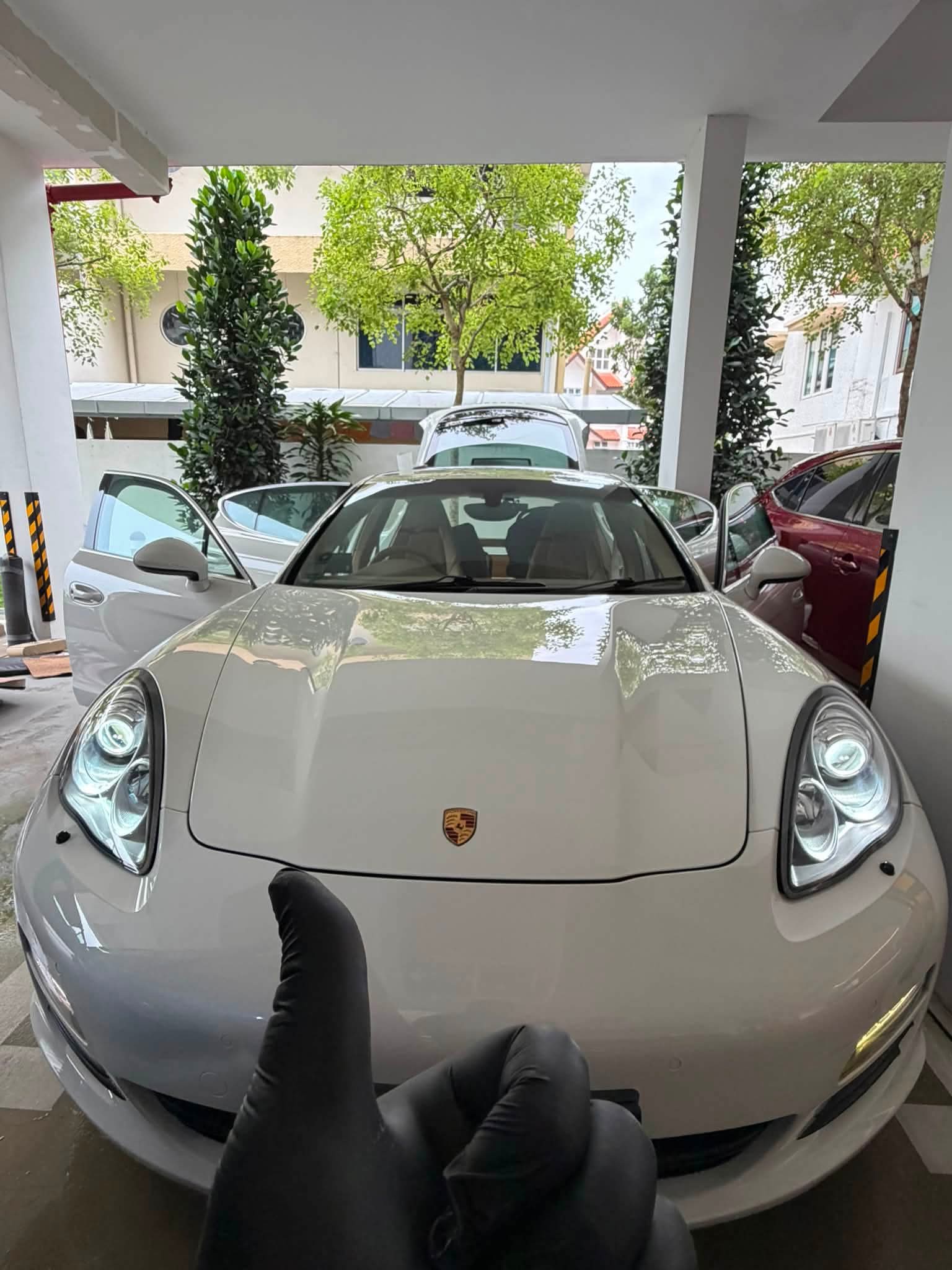 White Porsche Panamera S prepared for full detailing at doorstep Singapore