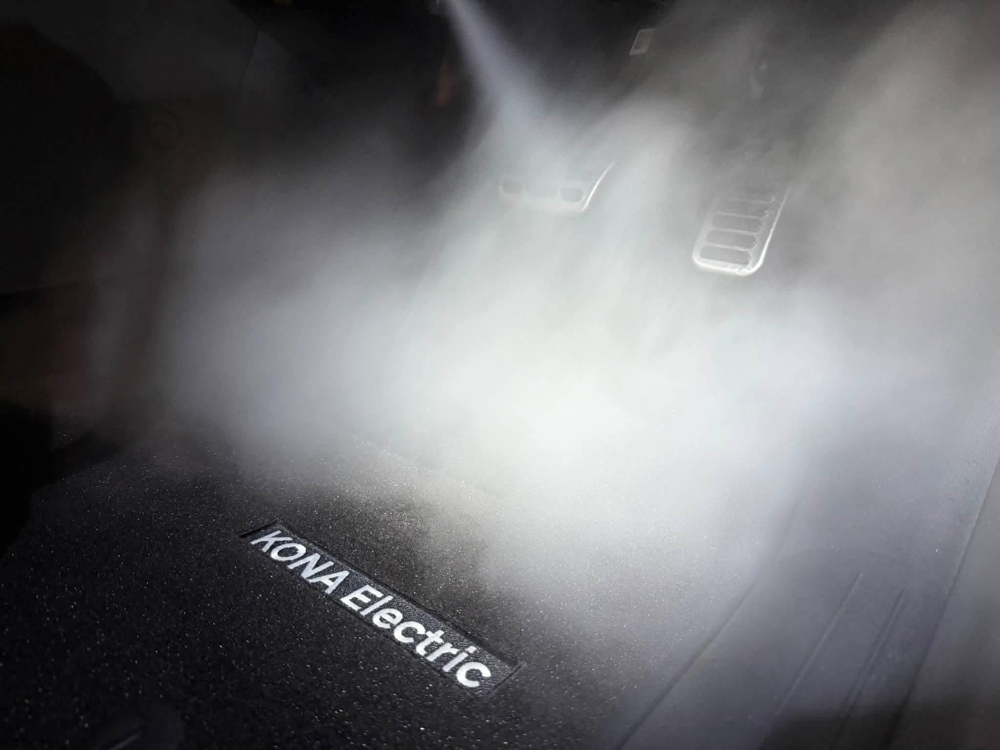 Hot steam cleaning treatment on car upholstery in progress
